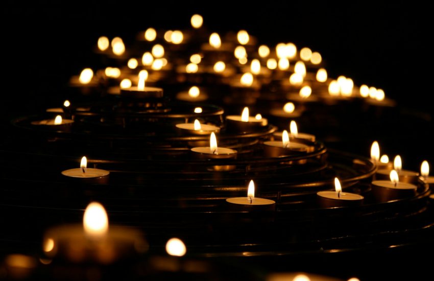 low-angle photo of lightened candles