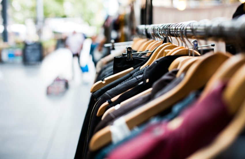 selective focus photography of hanged clothes